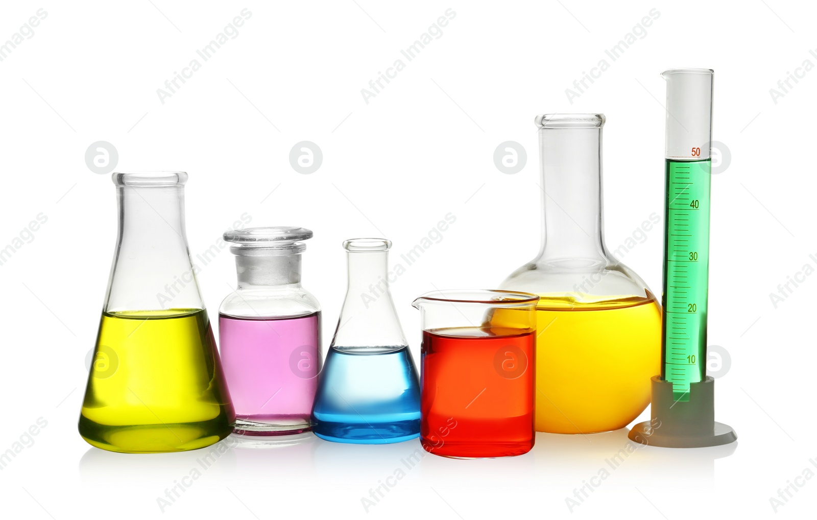 Photo of Laboratory glassware with colorful liquids on white background