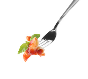 Delicious penne pasta with tomato sauce on fork against white background