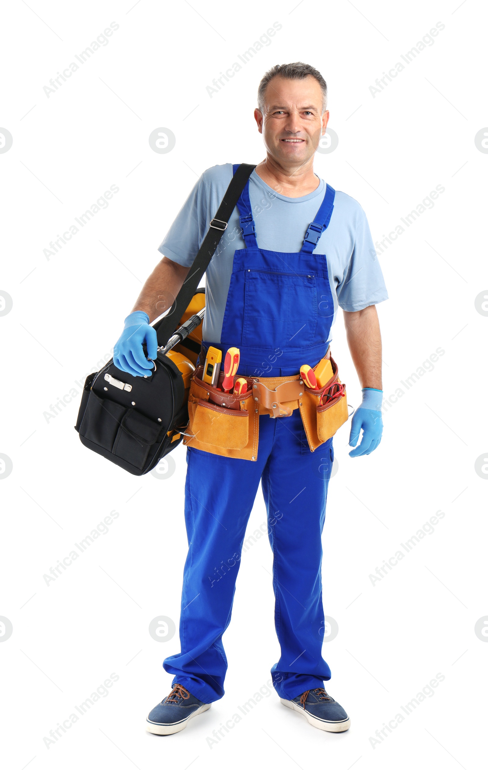 Photo of Electrician with tools wearing uniform on white background