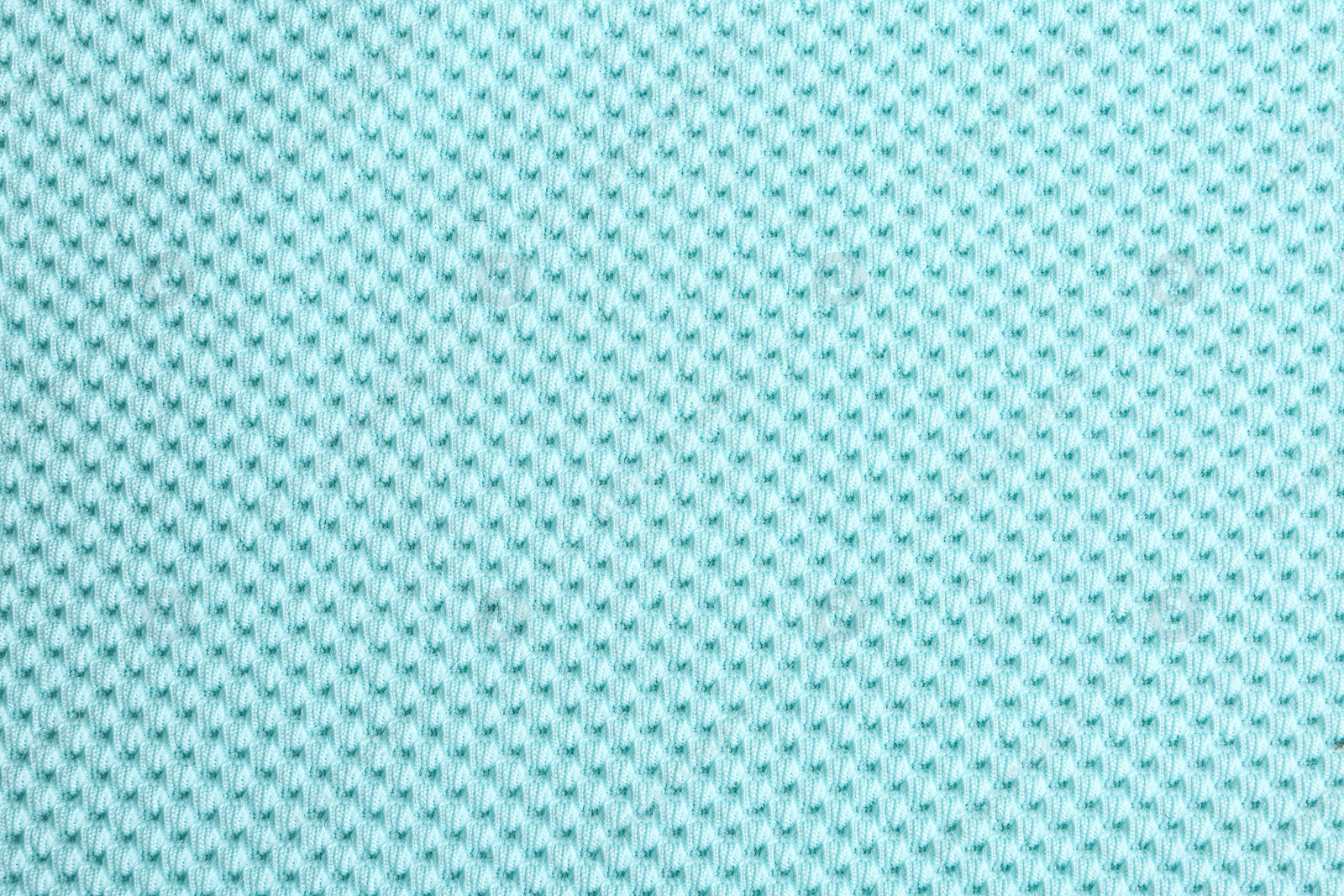 Photo of Textured light blue fabric as background, closeup