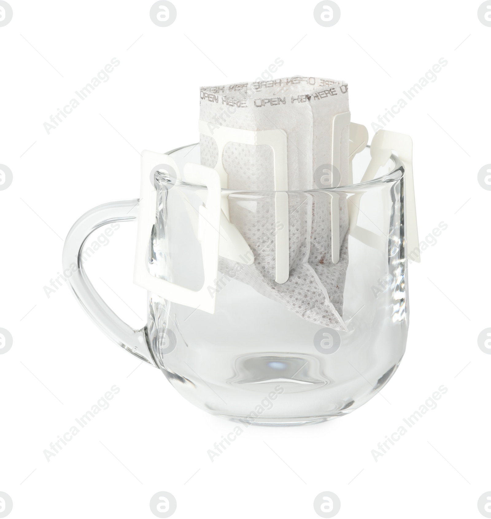 Photo of Glass cup with drip coffee bag isolated on white