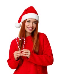 Photo of Young woman in red sweater and Santa hat with candy canes on white background. Christmas celebration