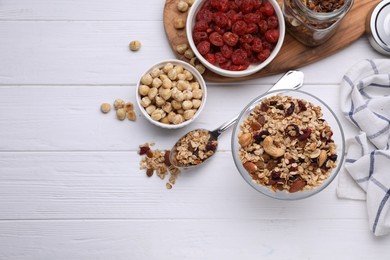 Flat lay composition with tasty granola on white wooden table. Space for text