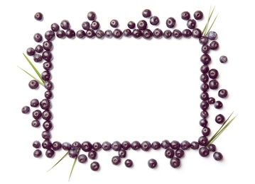 Photo of Frame made of fresh acai berries and leaves on white background