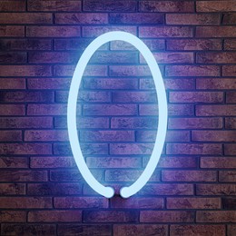 Image of Glowing neon number 0 sign on brick wall