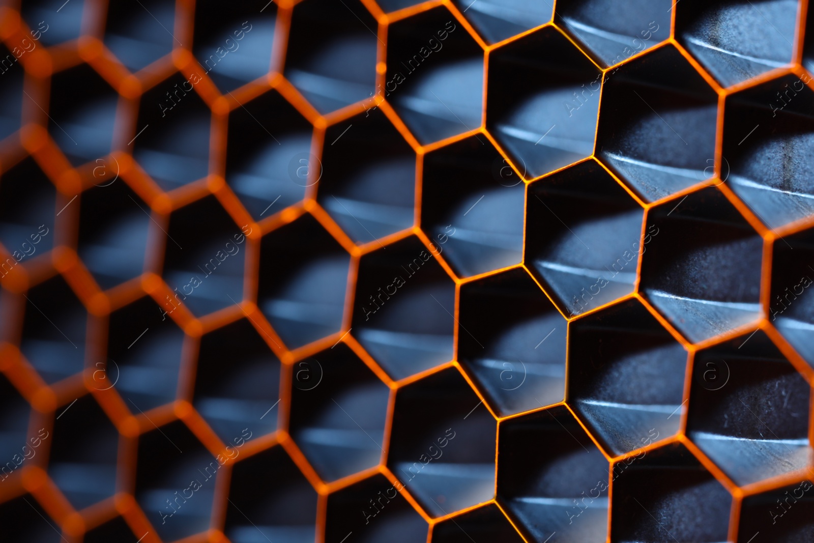 Photo of Texture of honeycomb grid for reflector as background, macro view