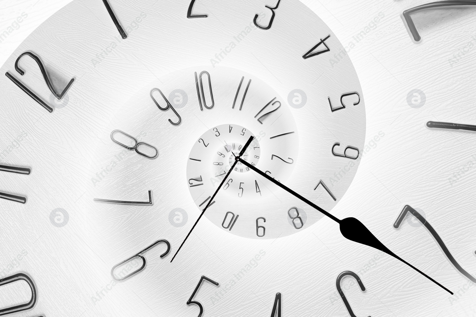 Image of Infinity and other time related concepts. White clock face twisted in spiral, fractal pattern