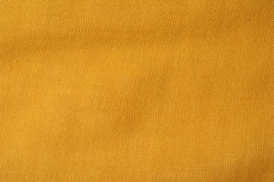 Texture of bright orange fabric as background, top view