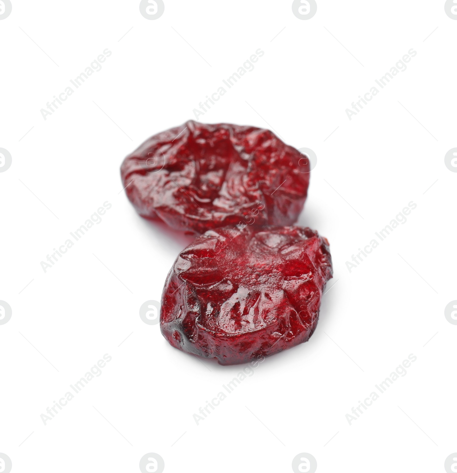 Photo of Two tasty dried cranberries isolated on white