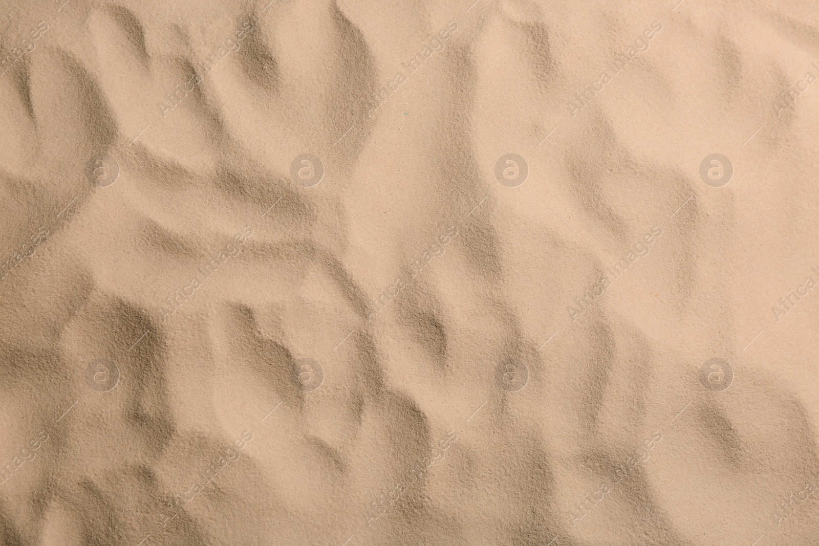 Photo of Dry beach sand as background, top view