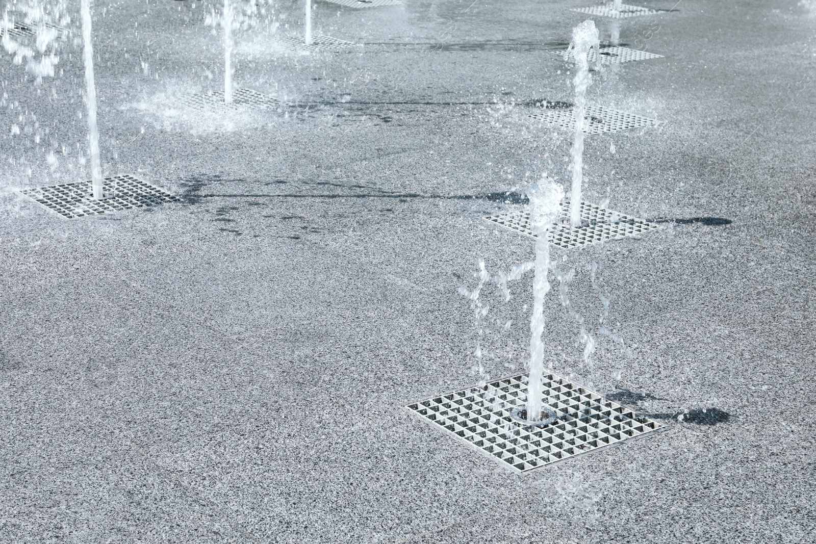Photo of View of beautiful floor fountains on sunny day