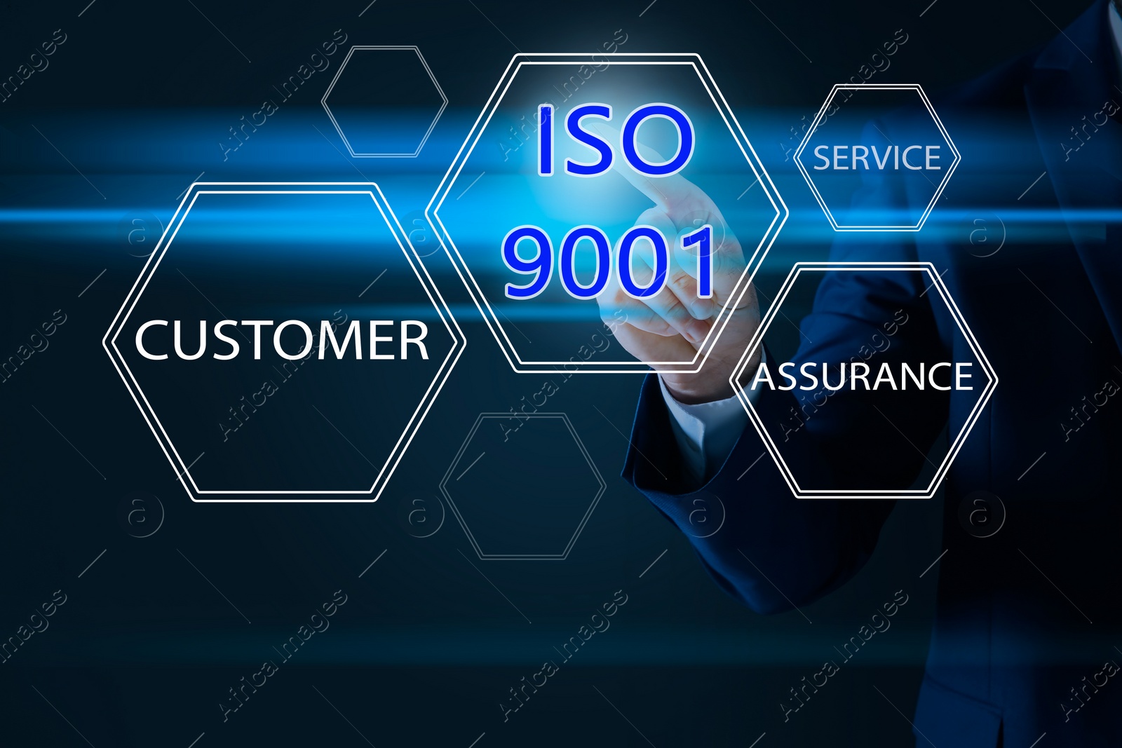 Image of Businessman pointing at virtual icon with text ISO 9001 on dark background, closeup