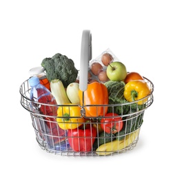 Shopping basket with grocery products on white background