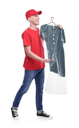 Dry-cleaning delivery. Happy courier holding dress in plastic bag on white background
