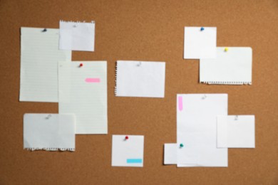 Photo of Blurred view of cork board with many colorful notes