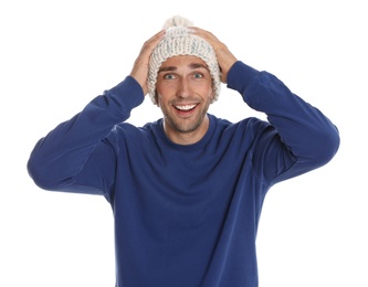 Photo of Happy young man in hat and blue sweatshirt on white background. Winter season