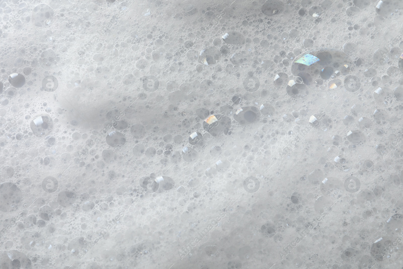 Photo of Fluffy soap foam as background, closeup view