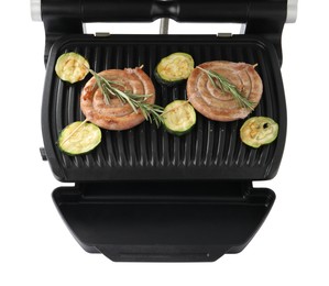 Photo of Electric grill with homemade sausages, zucchini and rosemary isolated on white