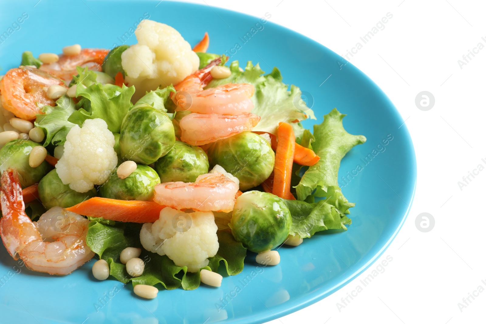 Photo of Plate of salad with Brussels sprouts isolated on white, closeup