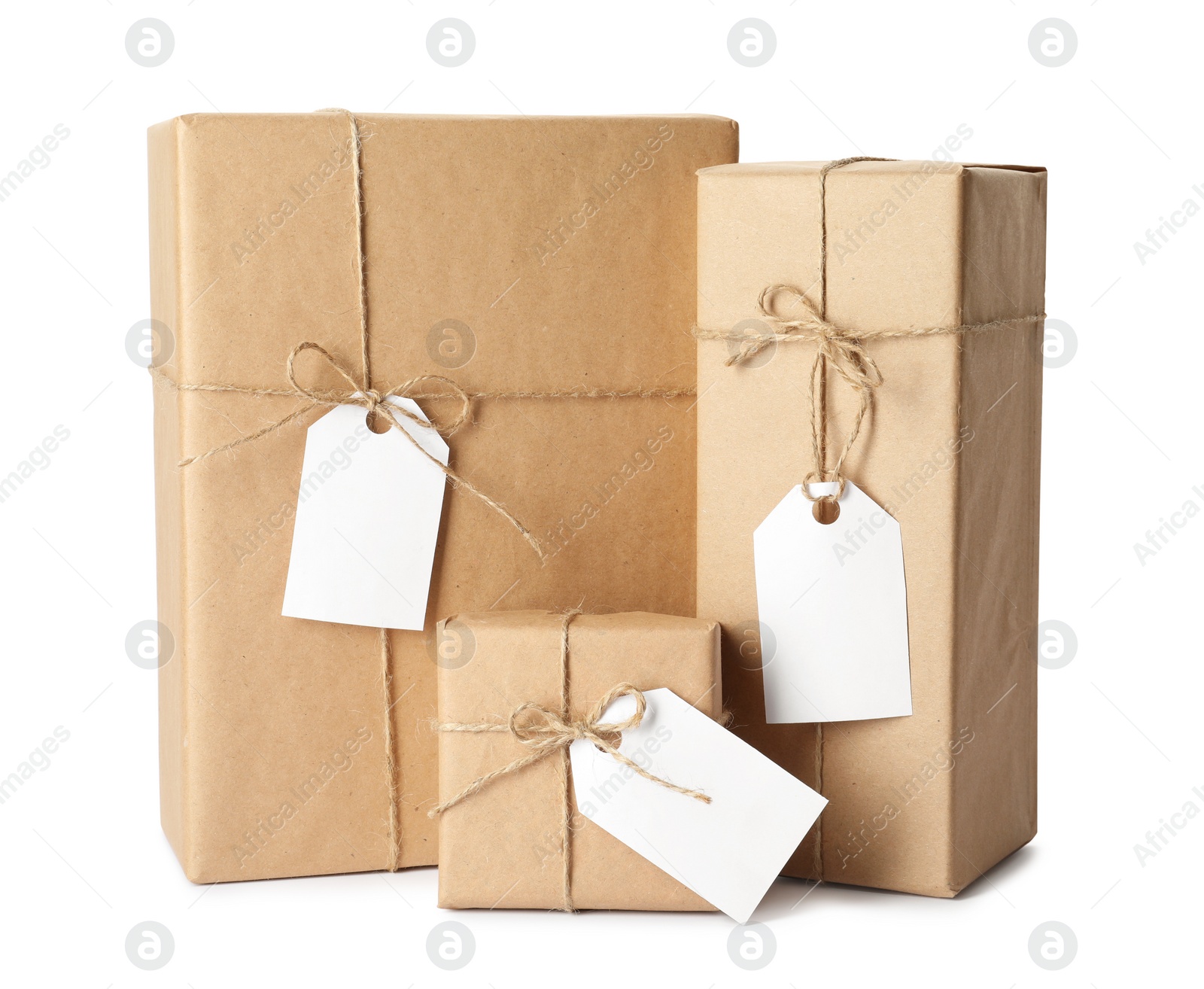 Photo of Gift boxes wrapped in kraft paper with tags on white background