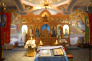 Blurred view of beautiful church interior with ecclesiastical icons