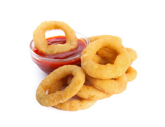 Delicious golden onion rings with ketchup isolated on white