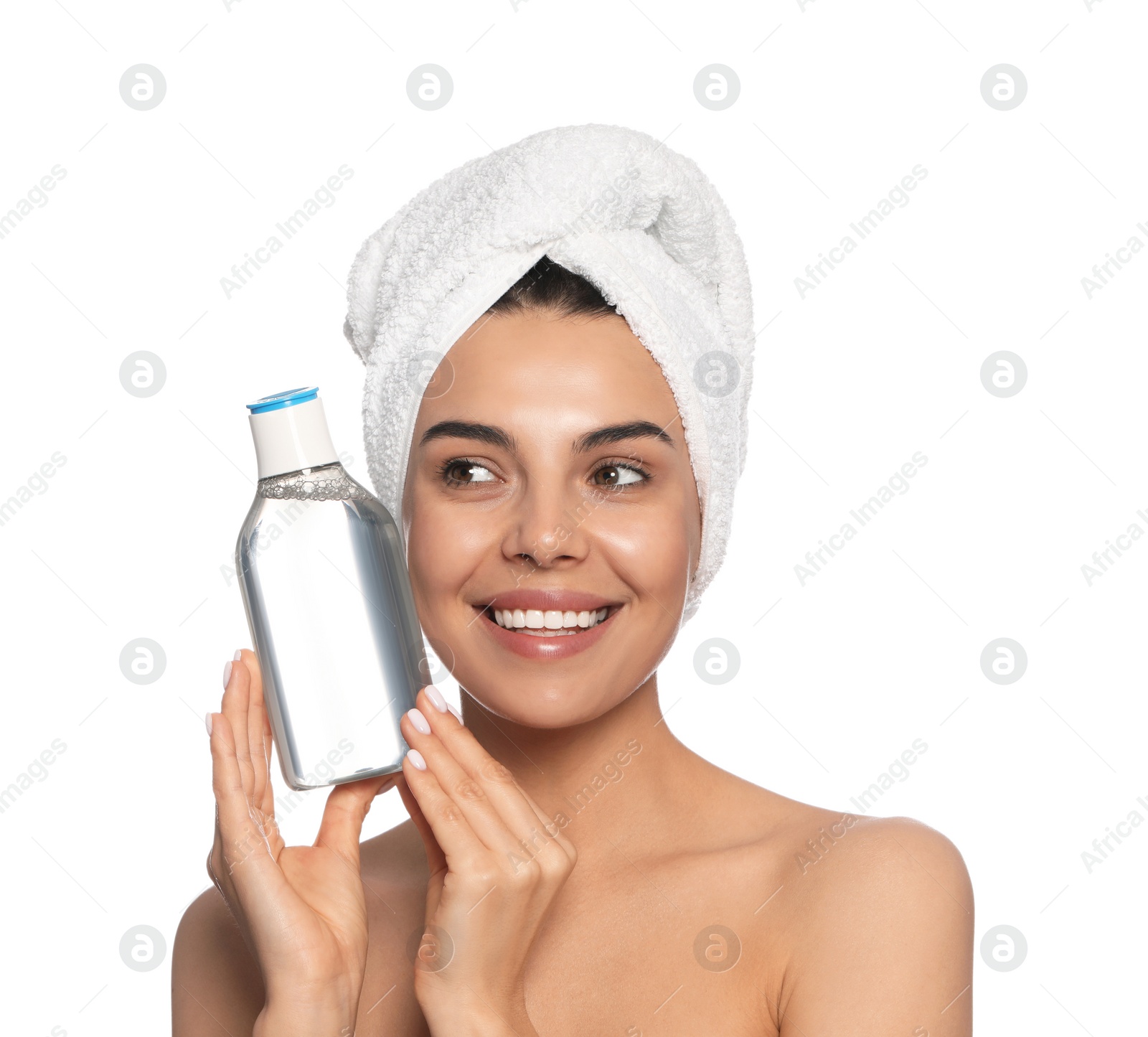 Photo of Young woman with bottle of micellar water on white background