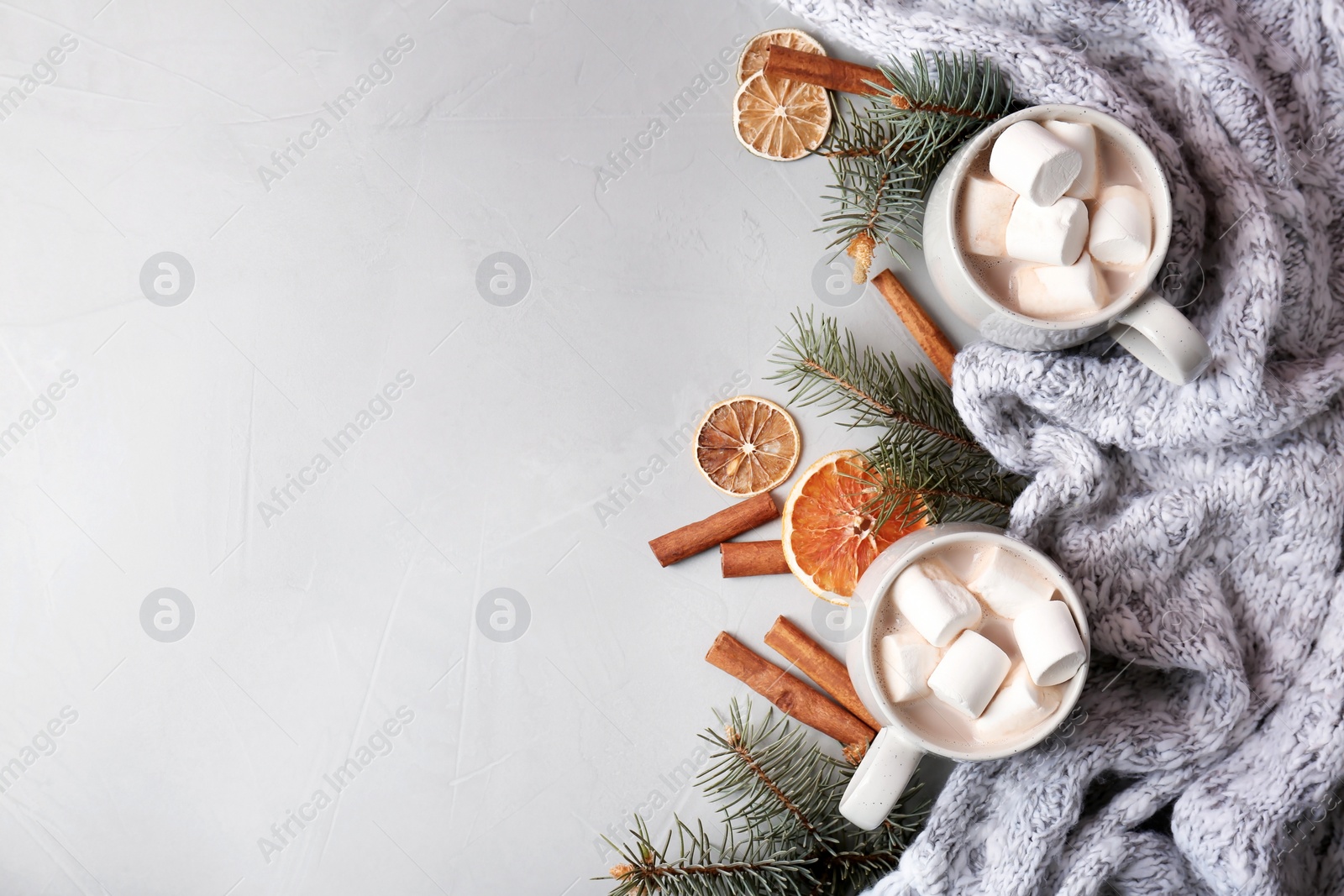 Photo of Flat lay composition with hot cocoa drink on grey background