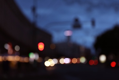 Photo of Blurred view of modern city at evening. Bokeh effect