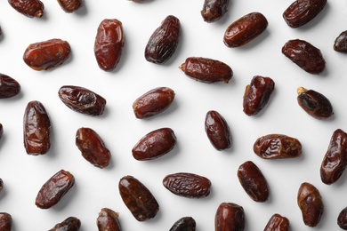 Photo of Sweet dates on white background, top view. Dried fruit as healthy snack