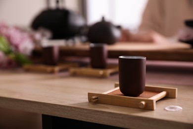 Cup for traditional tea ceremony on wooden table