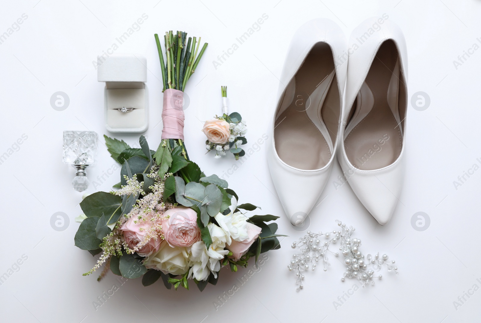 Photo of Composition with wedding high heel shoes on white background, top view