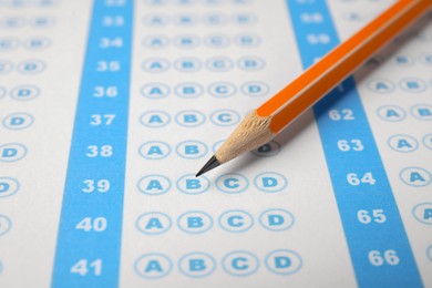 Pencil on answer sheet, closeup. Student passing exam