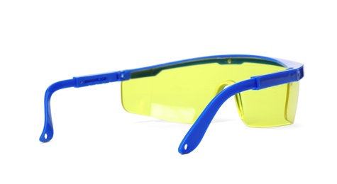 Photo of Protective goggles on white background. Construction tool