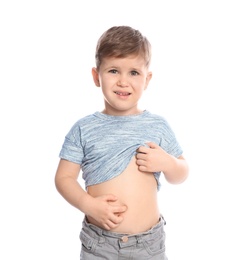Photo of Little boy scratching belly on white background. Annoying itch
