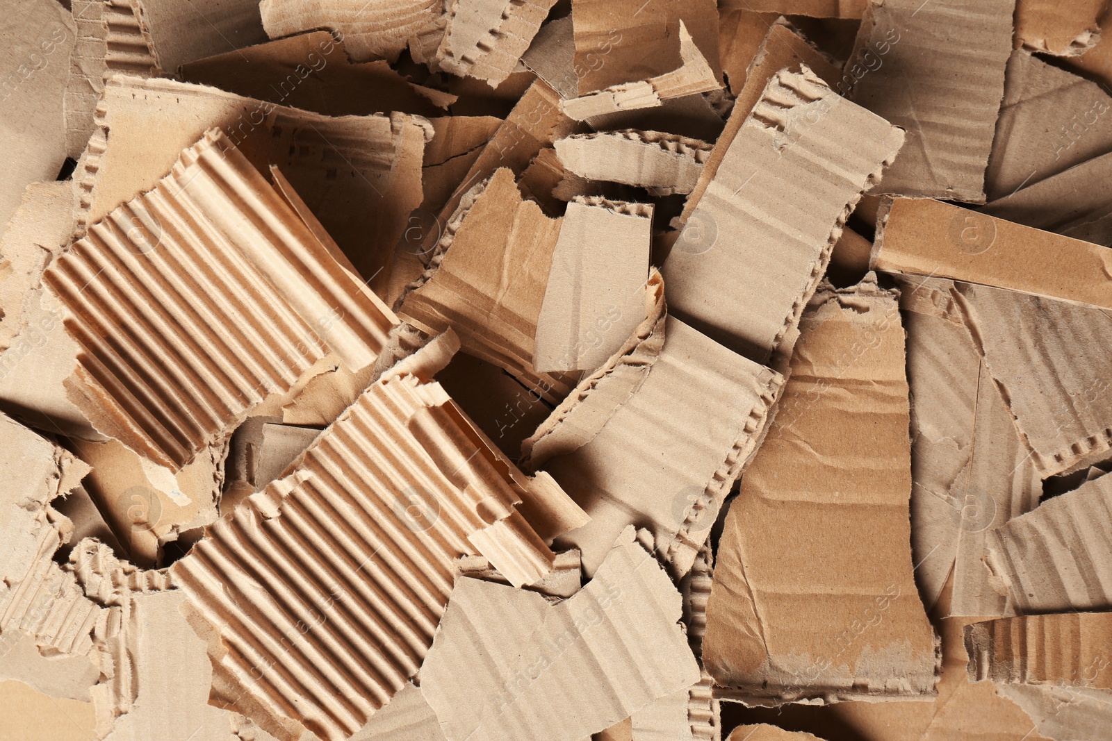 Photo of Pieces of brown cardboard as background, top view. Recyclable material