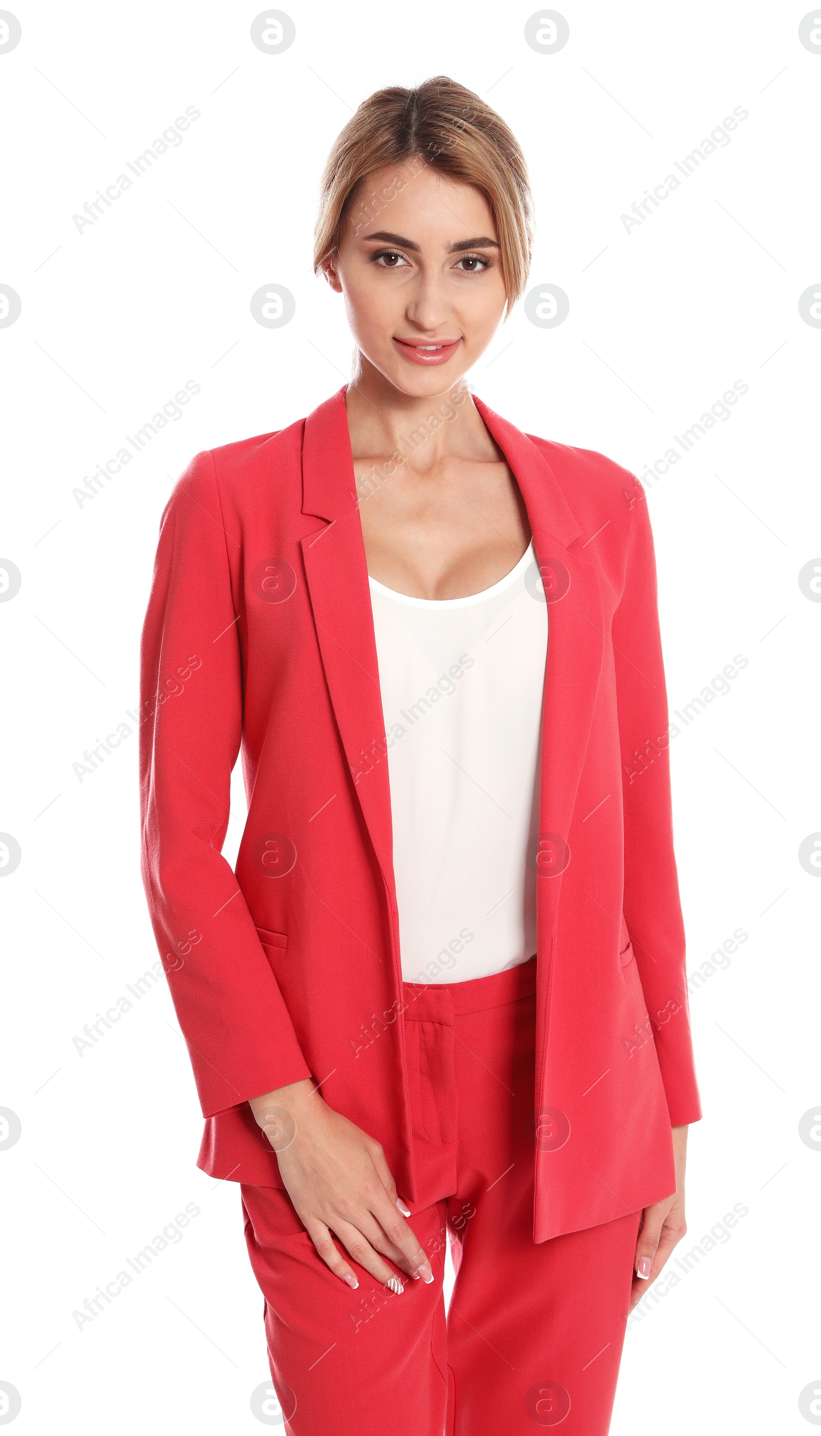 Photo of Beautiful young woman in red suit posing on white background