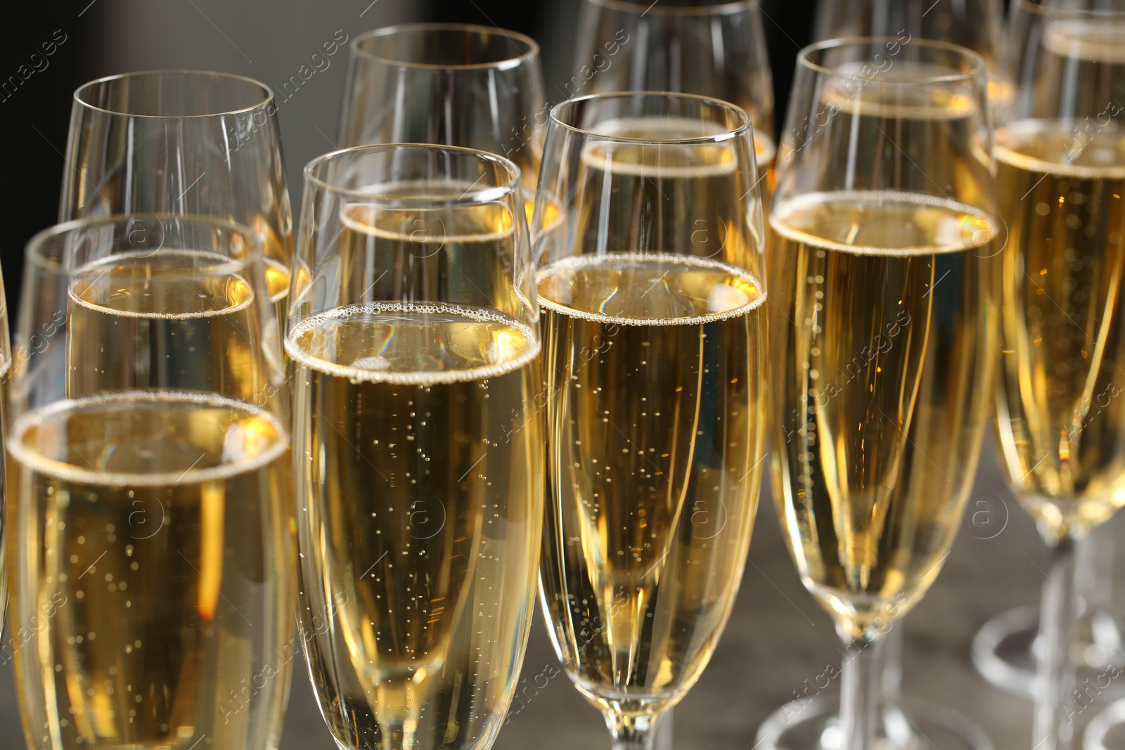 Photo of Many glasses of champagne, closeup. Festive drink