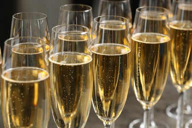 Photo of Many glasses of champagne, closeup. Festive drink