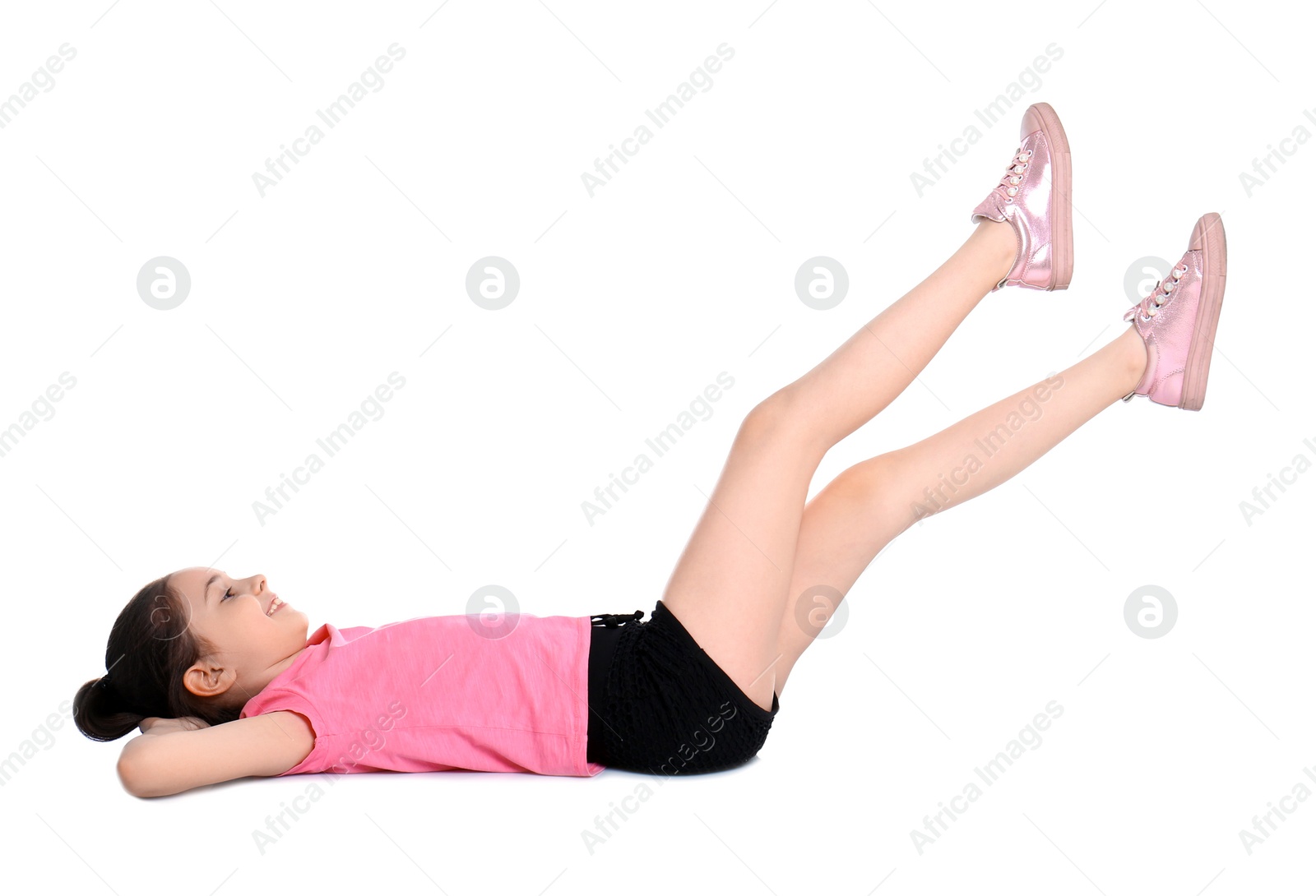 Photo of Little girl doing scissors exercise on white background