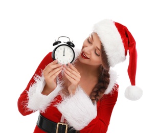 Beautiful Santa girl with alarm clock on white background. Christmas eve