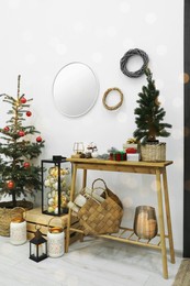 Photo of Christmas tree and different festive decor indoors