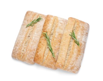 Photo of Crispy ciabattas with rosemary on white background, top view. Fresh bread