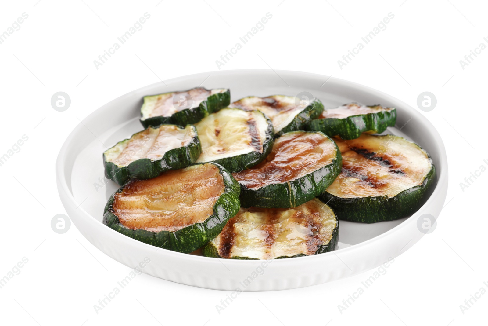 Photo of Plate of delicious grilled zucchini slices on white background