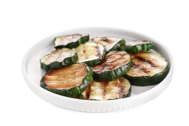 Photo of Plate of delicious grilled zucchini slices on white background