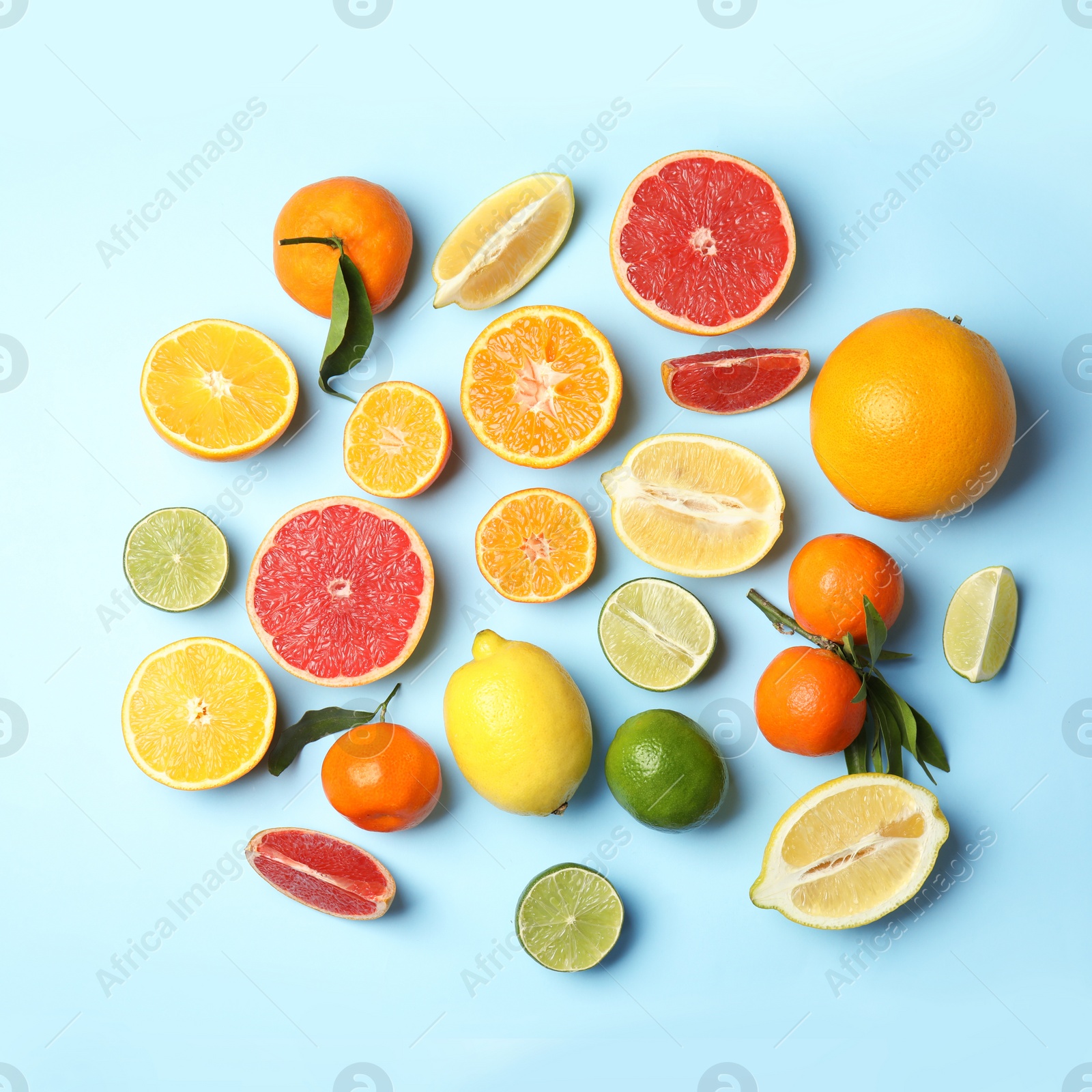 Photo of Different citrus fruits on color background, flat lay