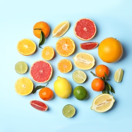 Photo of Different citrus fruits on color background, flat lay