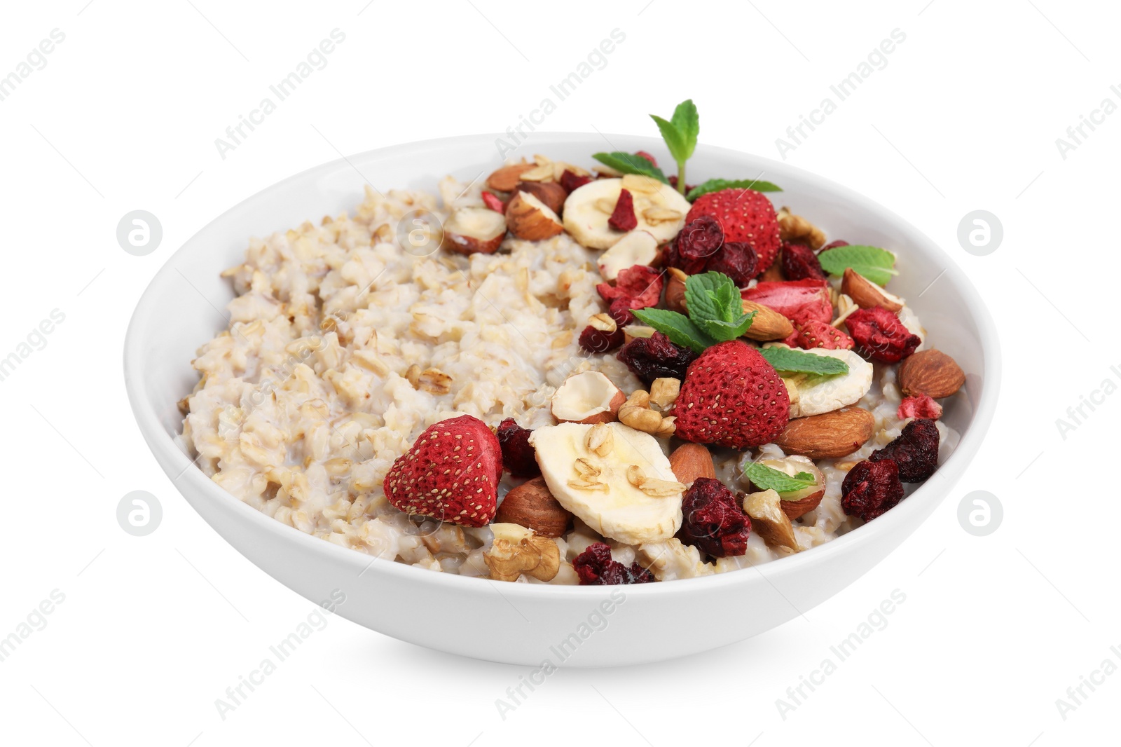 Photo of Delicious oatmeal with freeze dried berries, banana, nuts and mint on white background