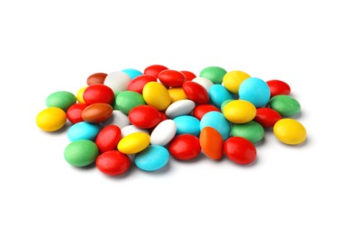 Photo of Many small colorful candies on white background