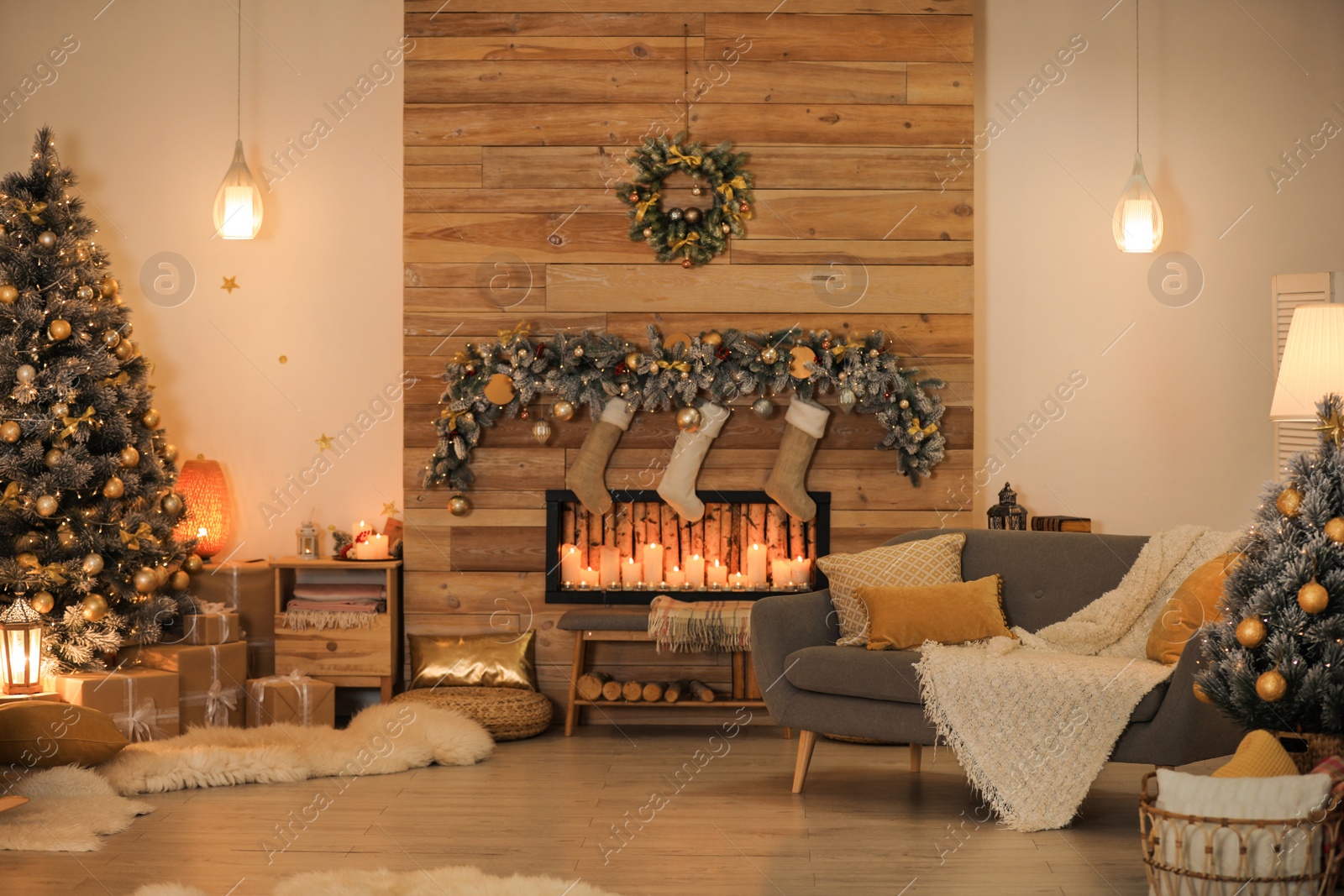 Photo of Stylish room interior with beautiful Christmas tree and decorative fireplace